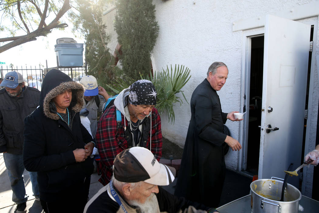 The Rev. Courtney Krier tests soup during the free breakfast at St. Joseph's Catholic Church on ...