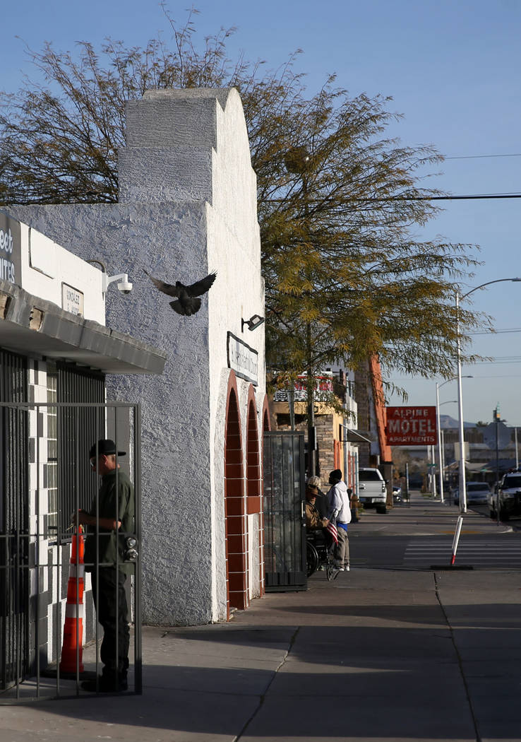 People line up for free breakfast service at St. Joseph's Catholic Church on North Ninth Street ...