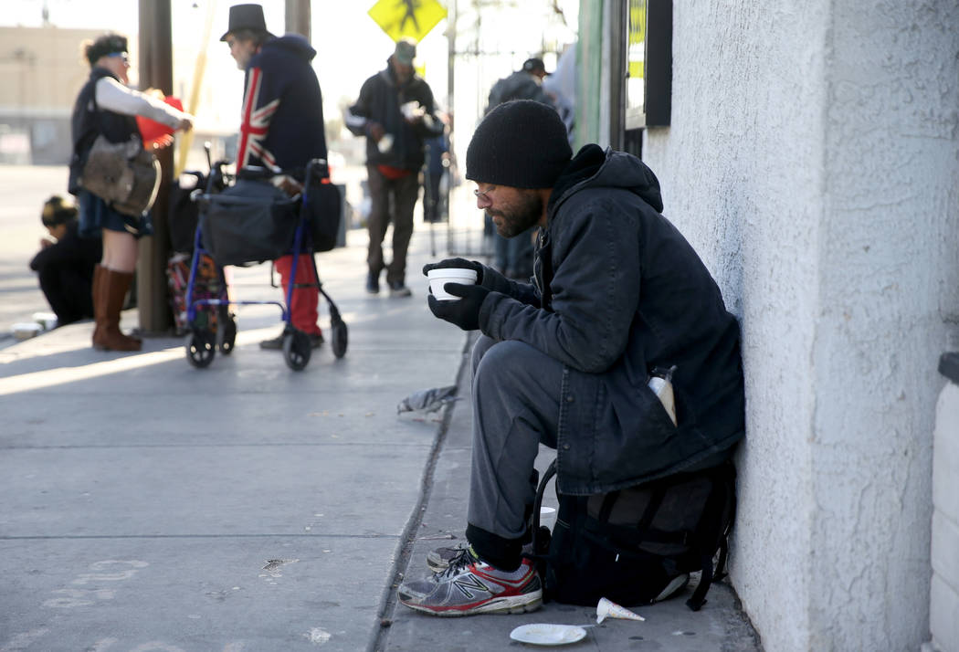 David Gibson eats a free breakfast at St. Joseph's Catholic Church on North Ninth Street at Eas ...