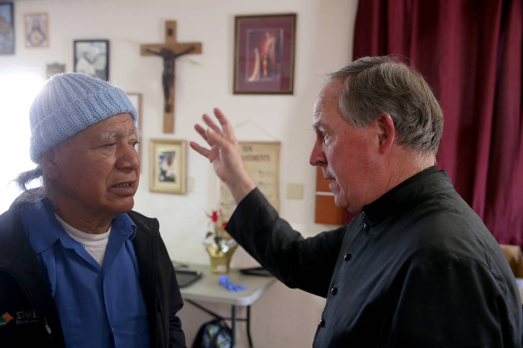 The Rev. Courtney Krier talks with Fidencio Vasquez after a free breakfast at St. Joseph's Cath ...