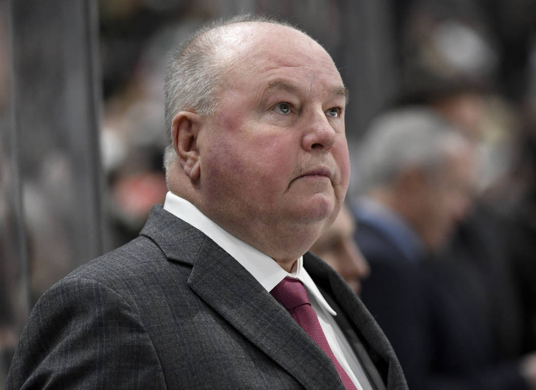 Minnesota Wild head coach Bruce Boudreau watches from the bench as his team plays against the T ...