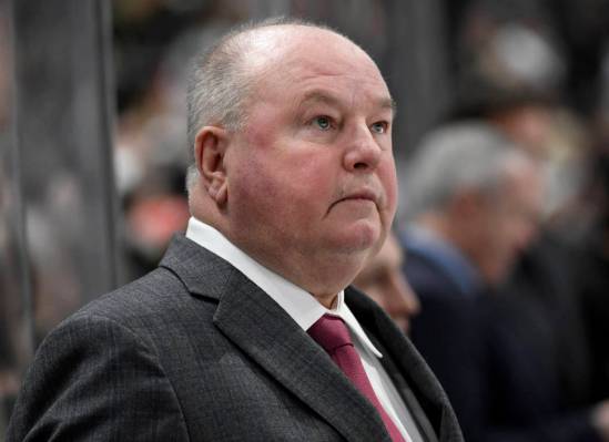 Minnesota Wild head coach Bruce Boudreau watches from the bench as his team plays against the T ...