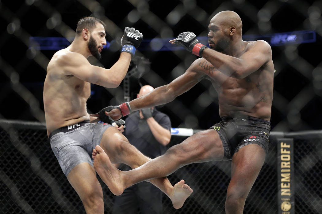 Dominick Reyes, left, and Jon Jones, right, during a light heavyweight mixed martial arts bout ...