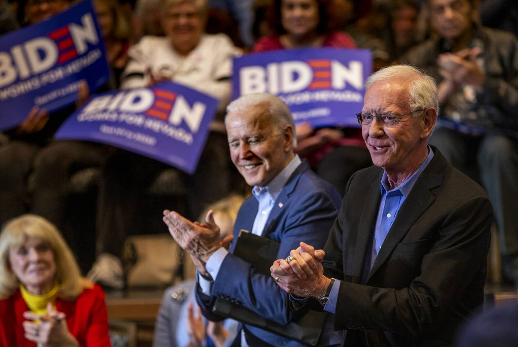 Former Vice President Joe Biden, left, claps while sitting beside Capt. Chesley "Sully&qu ...