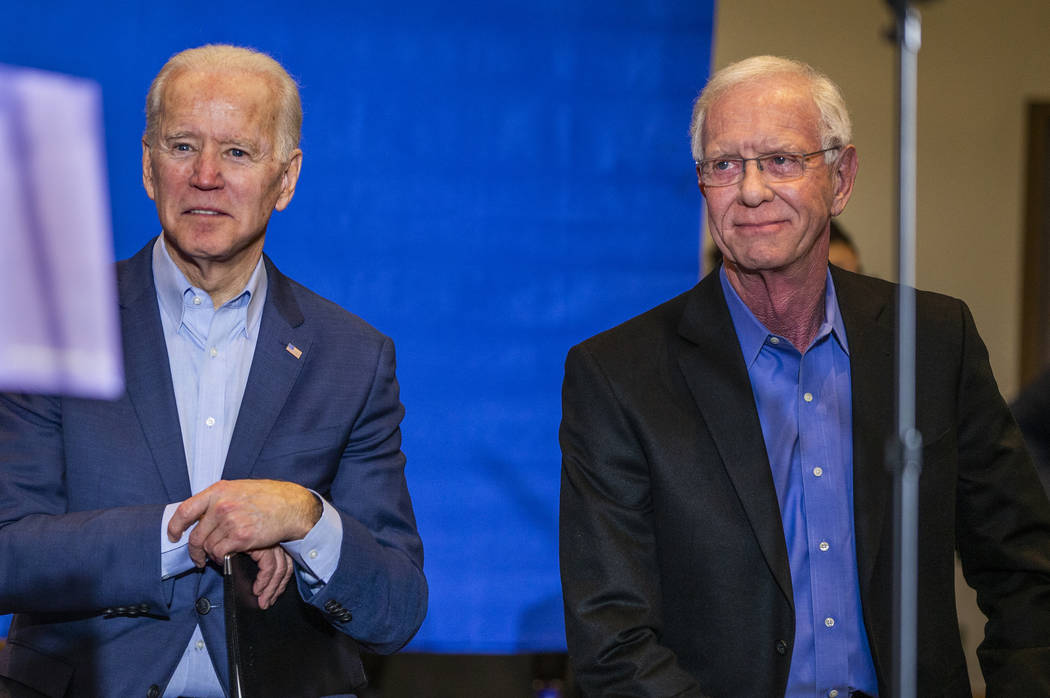 Former Vice President Joe Biden, left, looks on while sitting beside Capt. Chesley "Sully ...