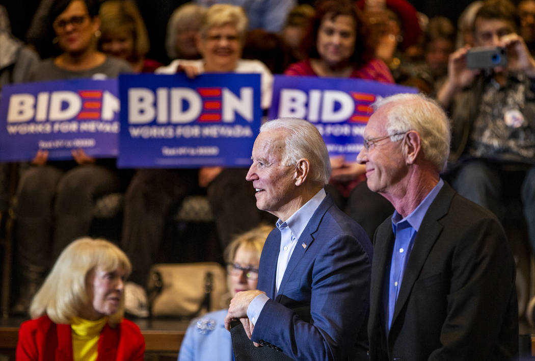 Former Vice President Joe Biden, left, looks on while sitting beside Capt. Chesley "Sully ...
