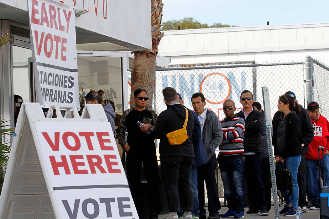 People line up to vote on the first day of early voting in the Nevada Democratic Party's presid ...