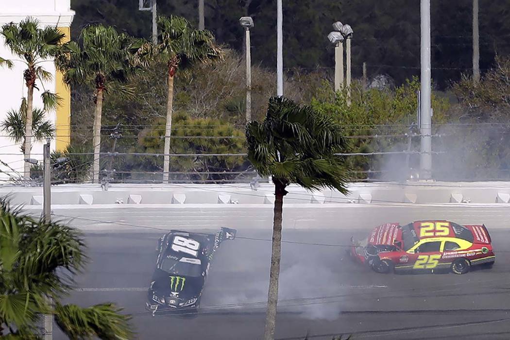 Riley Herbst (18) and Chris Cockrum (25) crash during the NASCAR Xfinity series auto race Satur ...