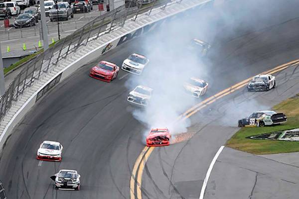 Justin Allgaier (7) drives along the apron with smoke coming out of his car after rear-ending J ...