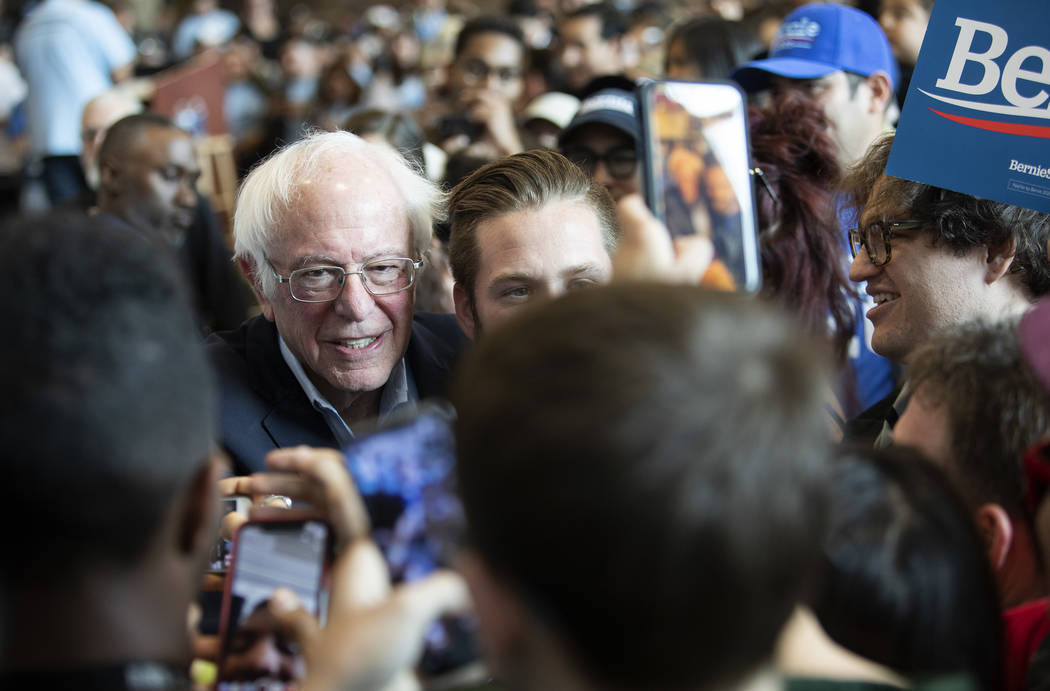 Sen. Bernie Sanders poses for selfies with supporters during the Get Out the Early Vote Rally a ...