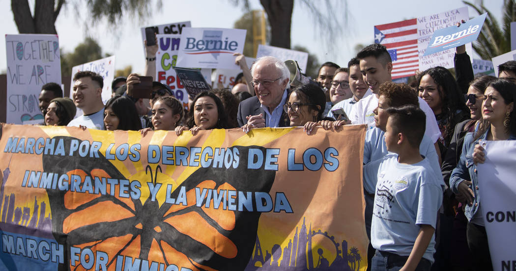 Sen. Bernie Sanders marches from Desert Pines High School to a polling location during the &quo ...