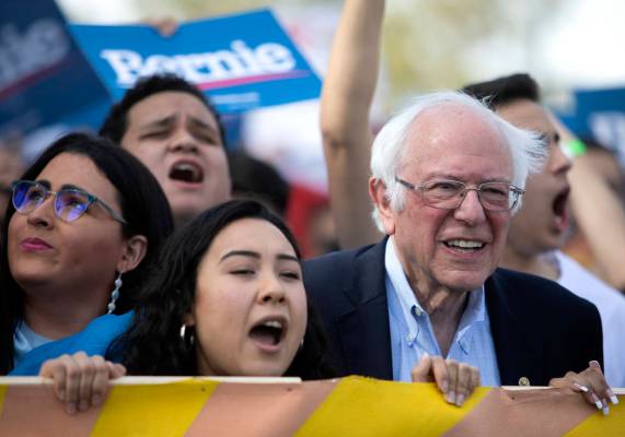 Sen. Bernie Sanders marches from Desert Pines High School to a polling location during the &quo ...