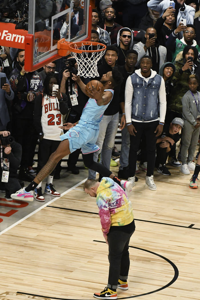 Miami Heat's Derrick Jones Jr. goes up for a dunk during the NBA All-Star slam dunk contest Sat ...