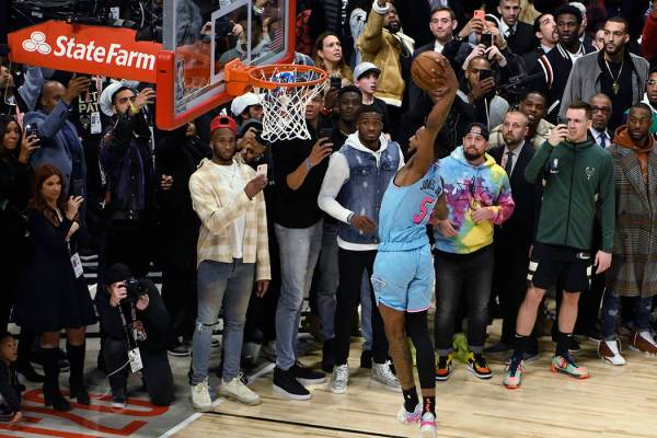 Miami Heat's Derrick Jones Jr. goes up for a dunk during the NBA All-Star slam dunk contest Sat ...
