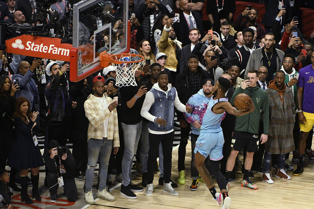 Miami Heat's Derrick Jones Jr. competes in the NBA All-Star slam dunk contest Saturday, Feb. 15 ...