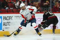 Washington Capitals left wing Alex Ovechkin (8) tries to control the puck in front of Arizona C ...