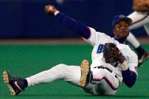 In this Sept. 17, 1999, file photo, Toronto Blue Jays third baseman Tony Fernandez throws to fi ...
