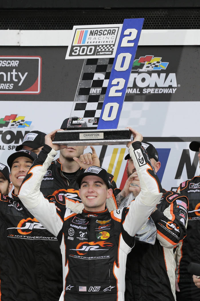 Noah Gragson holds up the trophy after winning the NASCAR Xfinity series auto race at Daytona I ...