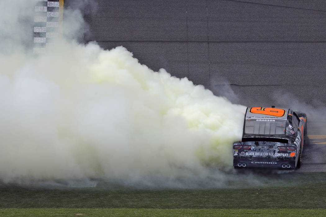 Noah Gragson burns his tires as he celebrates winning the NASCAR Xfinity series auto race Satur ...