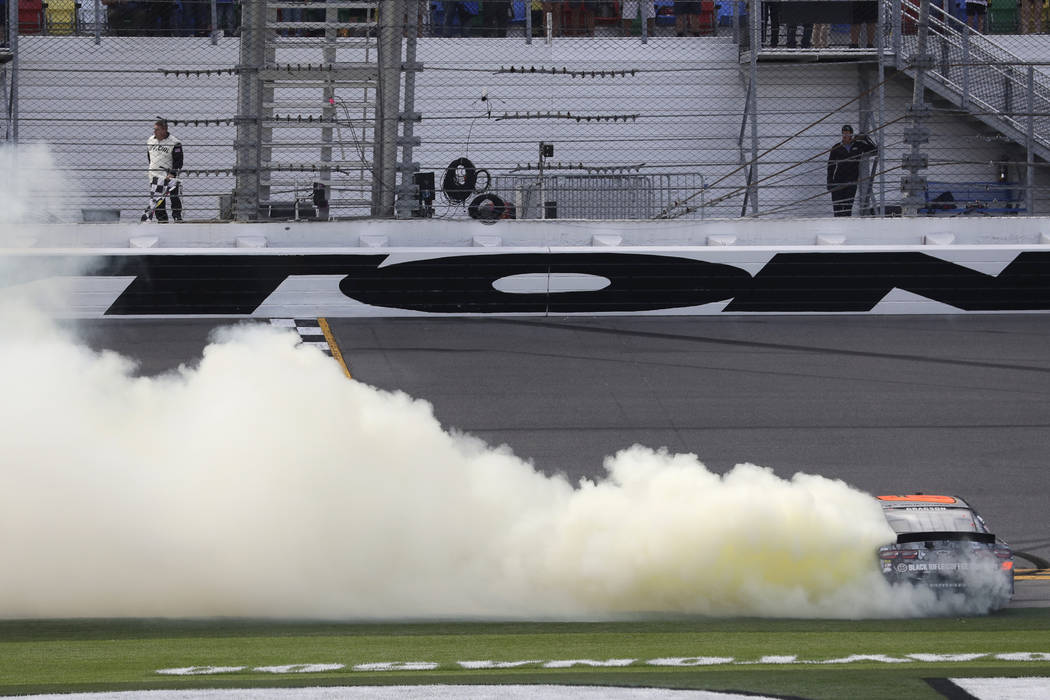 Noah Gragson does a burnout after winning the NASCAR Xfinity series auto race at Daytona Intern ...