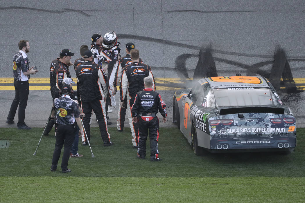 Noah Gragson celebrates with his crew after winning the NASCAR Xfinity series auto race Saturda ...