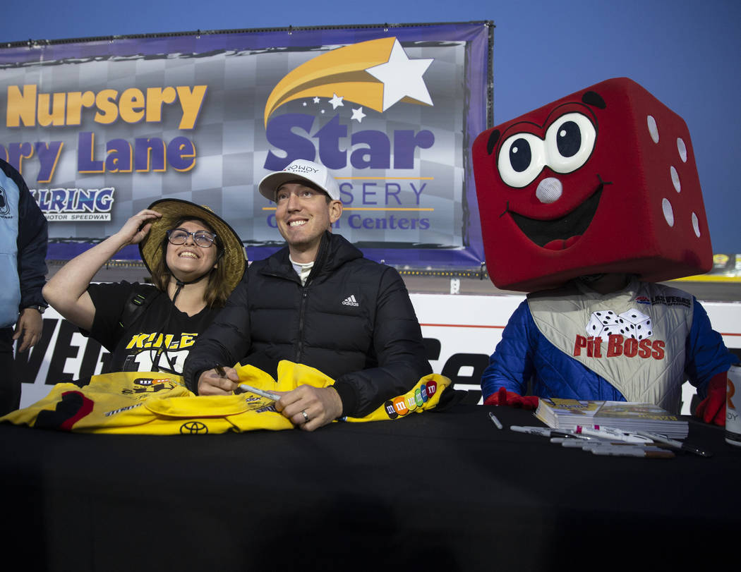 Diamante Elenes, left, takes a photo with NASCAR star Kyle Busch before the start of the Star N ...