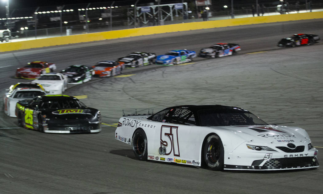 NASCAR star Kyle Busch turns the corner during the Star Nursery 100 Super Late Model feature ra ...