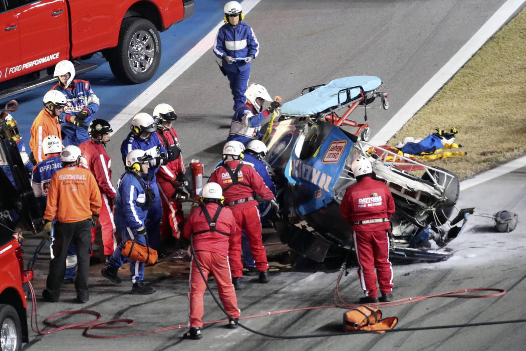 Rescue workers arrive to check on Ryan Newman after he was involved in a wreck on the last lap ...