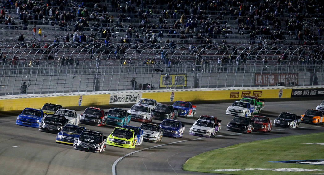 Kyle Busch (51) leads the pack during a re-start in the Strat 200 NASCAR Truck Series race at L ...