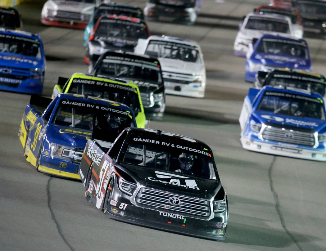 Kyle Busch (51) leads the pack during a re-start in the Strat 200 NASCAR Truck Series race at L ...