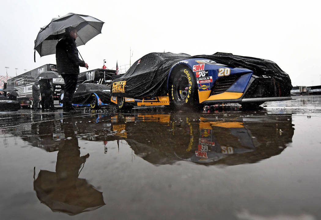 The crew of NASCAR Cup Series driver Erik Jones (20) Joe Gibbs Racing (JGR) Toyota Camry wait i ...