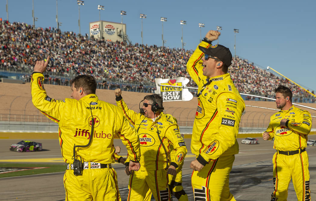 The pit crew of Joey Logano (22) celebrates their team win following the Pennzoil 400 presented ...