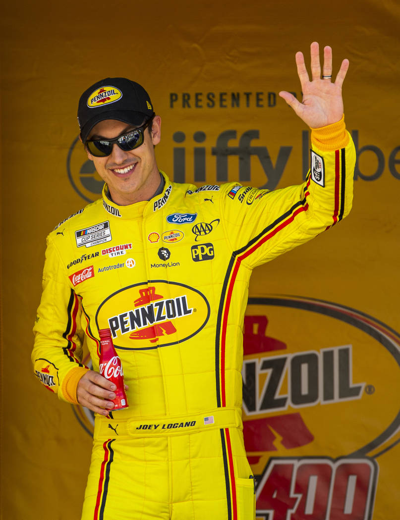 Joey Logano (22) is introduced to the fans before the start of the Pennzoil 400 presented by Ji ...