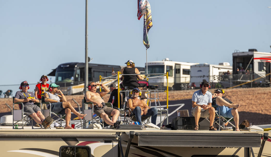 Fans hang out atop one of many RV's in the infield during the Pennzoil 400 presented by Jiffy L ...