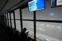 A downpour, as viewed from the press box, forces a postponement of the NASCAR Daytona 500 auto ...