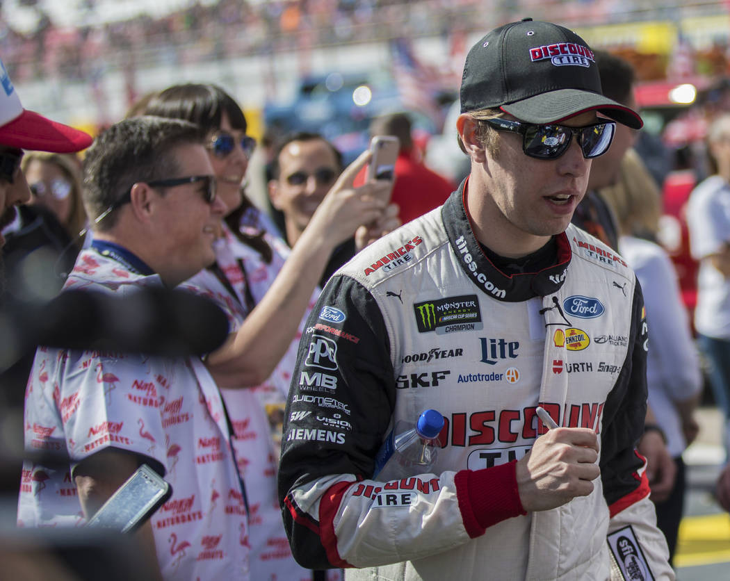 Brad Keselowski (2) walks to the podium to be announced before the start of the Monster Energy ...