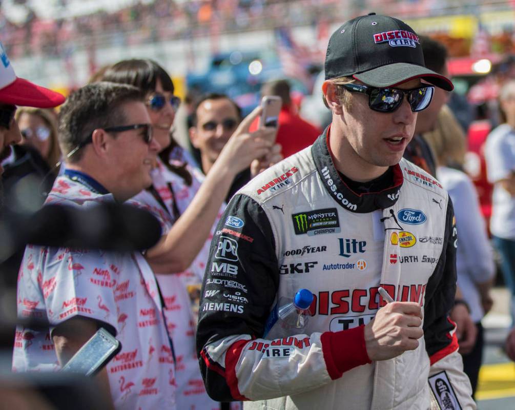 Brad Keselowski (2) walks to the podium to be announced before the start of the Monster Energy ...