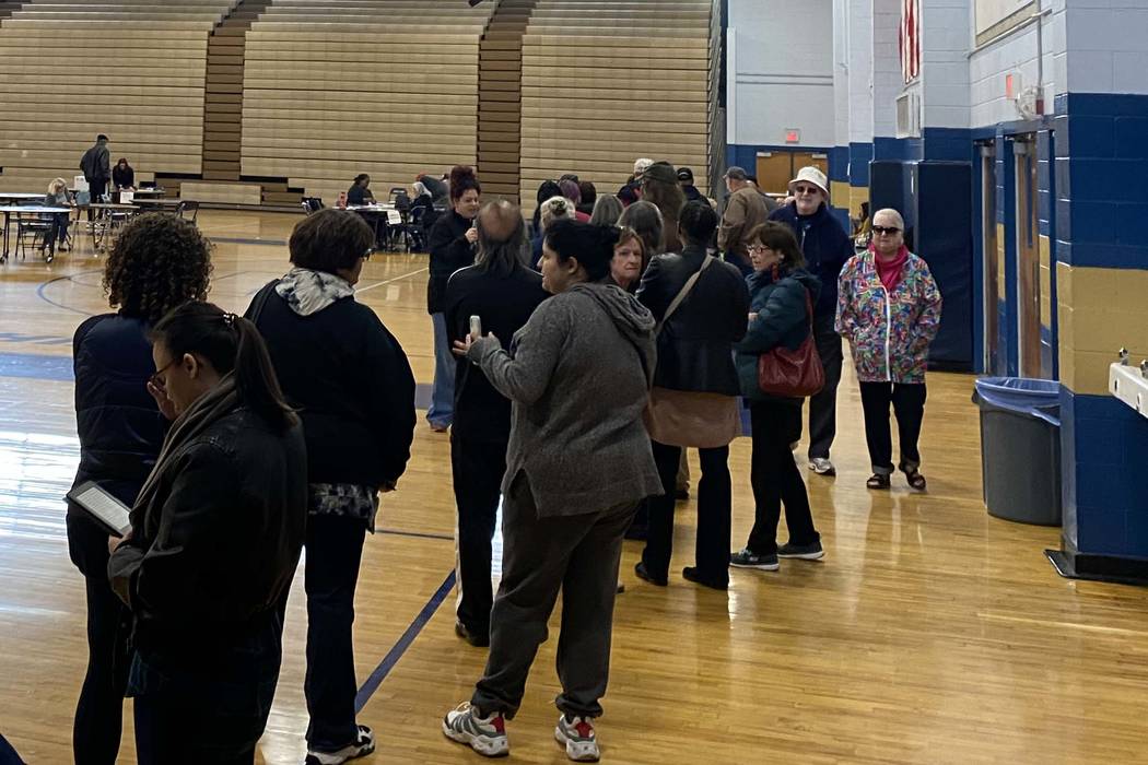Voters participating in early voting for the Democratic caucus faced long lines at Cheyenne Hig ...