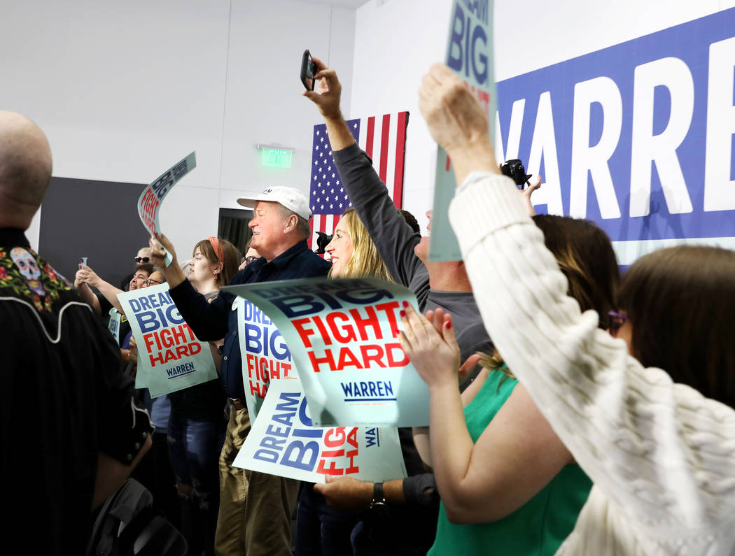 Supporters cheer for Sen. Elizabeth Warren as she speaks ahead of a town hall at College of Sou ...