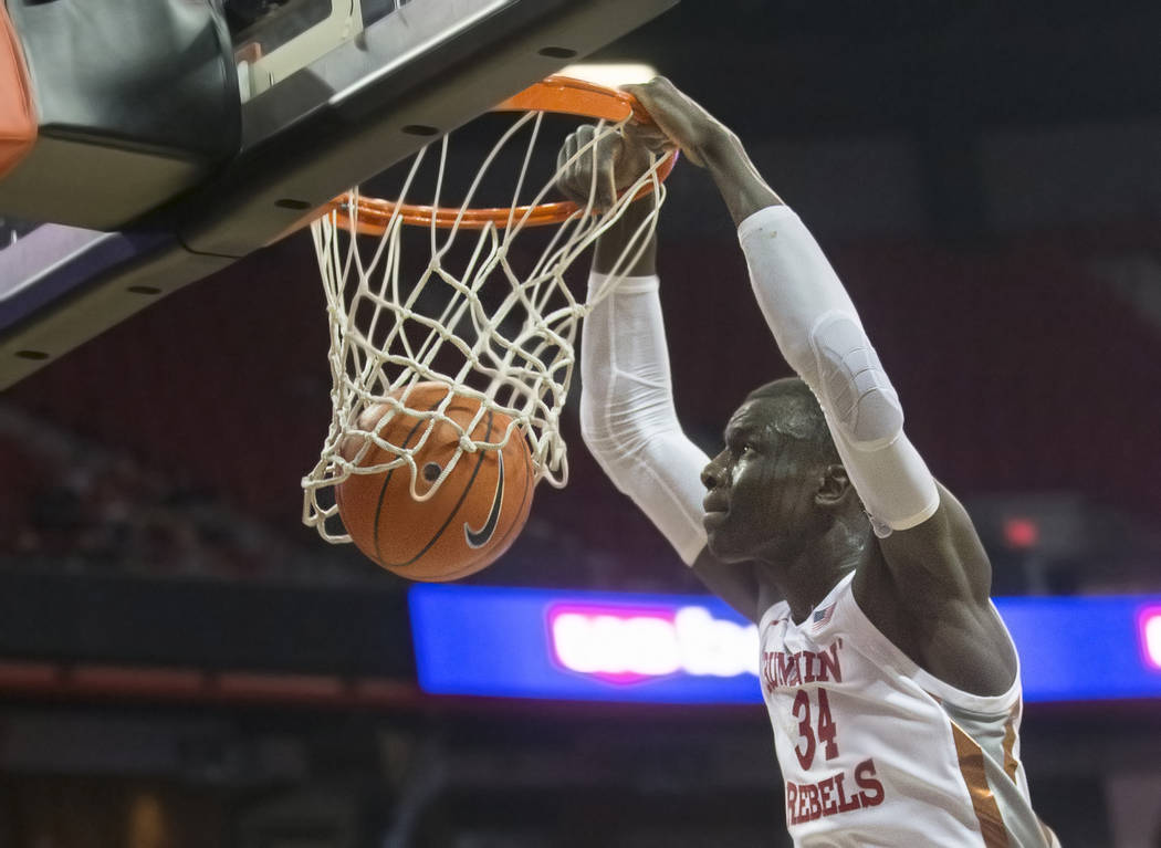 UNLV Rebels forward Mbacke Diong (34) dunks in the first half during an NCAA basketball game wi ...