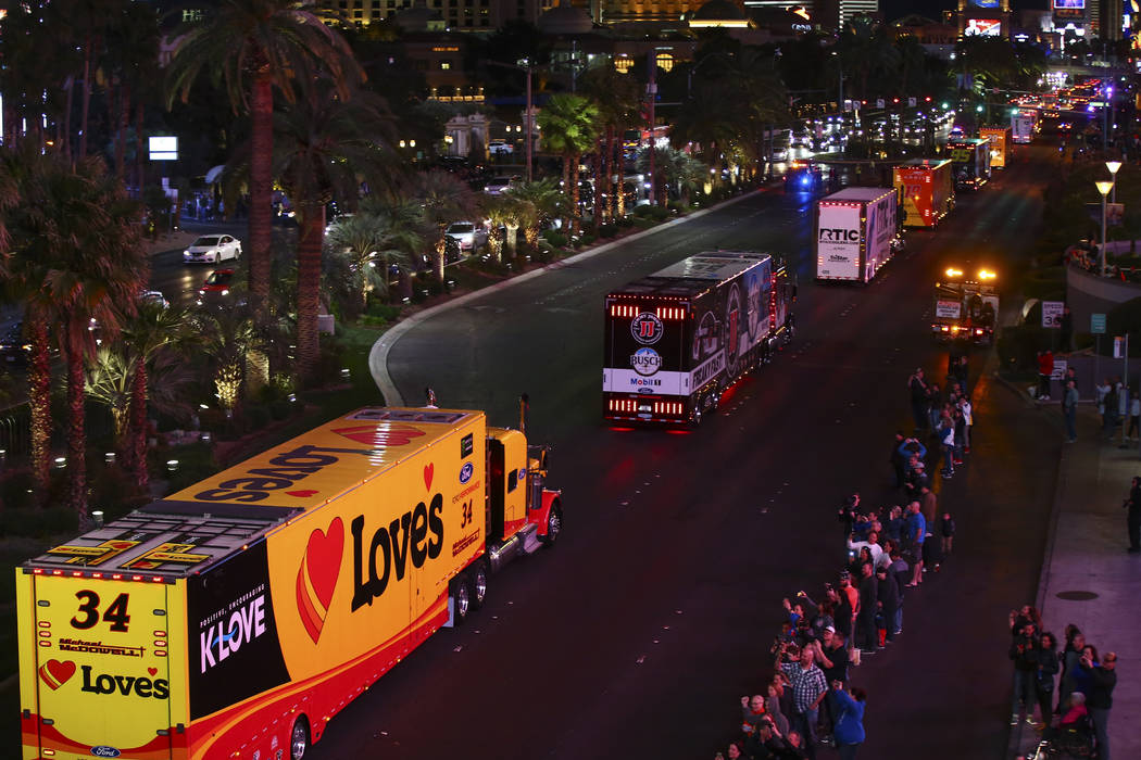 The haulers of Michael McDowell (34) and Kevin Harvick (4) parade down the Las Vegas Strip near ...