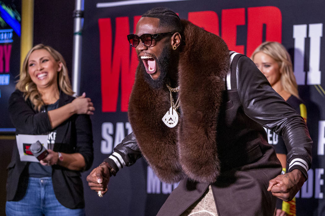WBC heavyweight title fighter Deontay Wilder yells for the crowd while on stage during the Gran ...