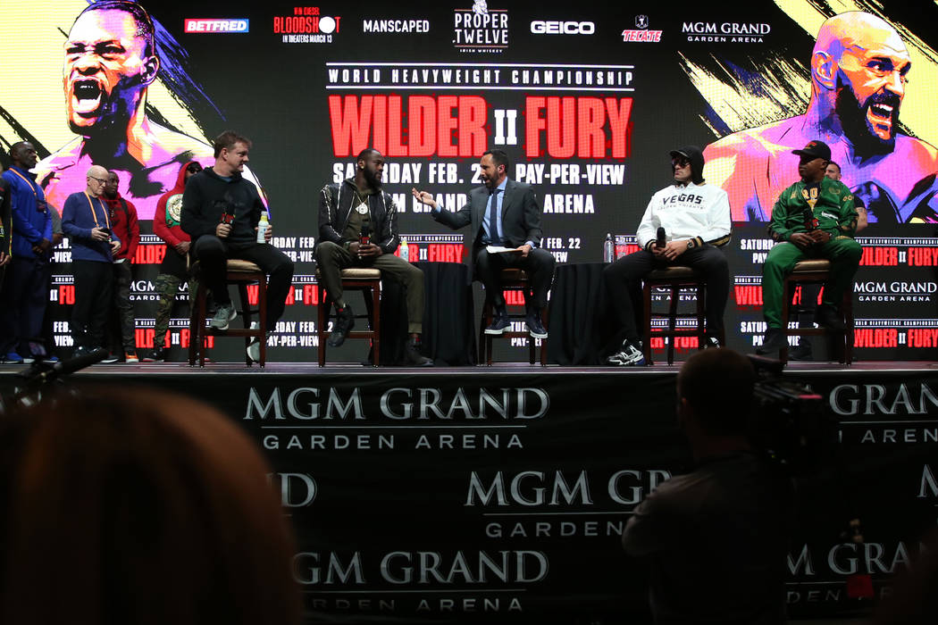 Deontay Wilder and Tyson Fury participate in a press conference at the MGM Grand Garden Arena i ...
