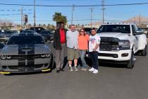 Sales Manager Jesse Aguirre, from left, Mitch Moore, Kristen Moore and Finance Manager Sanchez ...