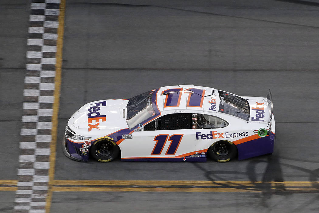 Denny Hamlin (11) gets to the line to win the second stage during the NASCAR Daytona 500 auto r ...
