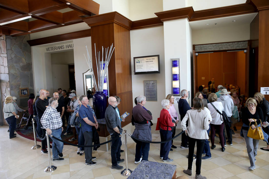 People line up for early voting in the Nevada Democratic caucuses at the Anthem Center in the S ...