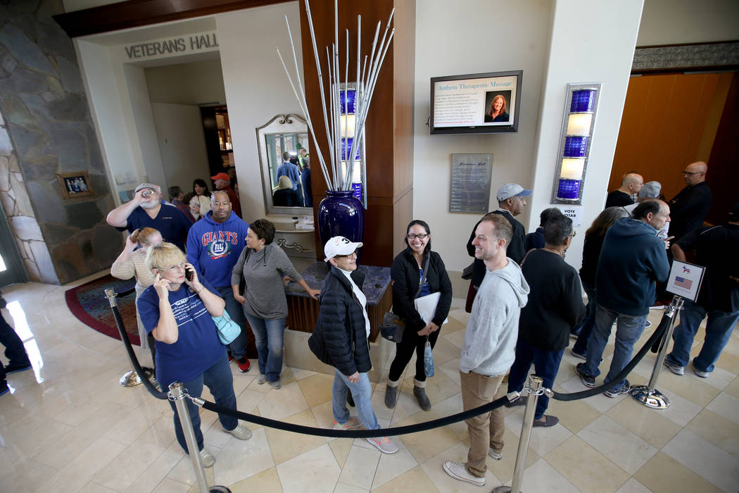 People line up for early voting in the Nevada Democratic caucuses at the Anthem Center in the S ...