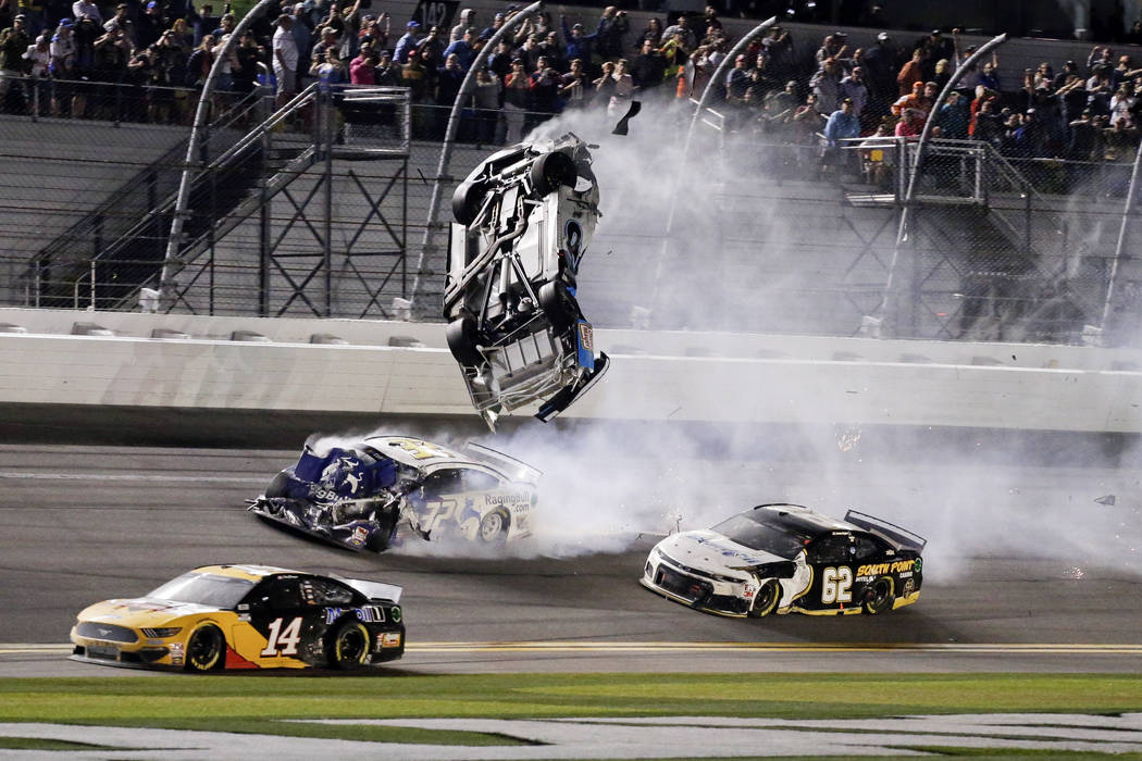Ryan Newman, top center, goes airborne as he is hit by Corey LaJoie (32) on the final lap of th ...