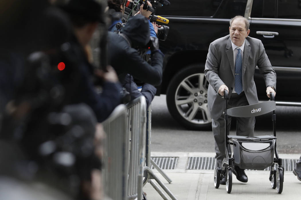 Harvey Weinstein talks to reporters as he arrives at a Manhattan courthouse for his rape trial ...