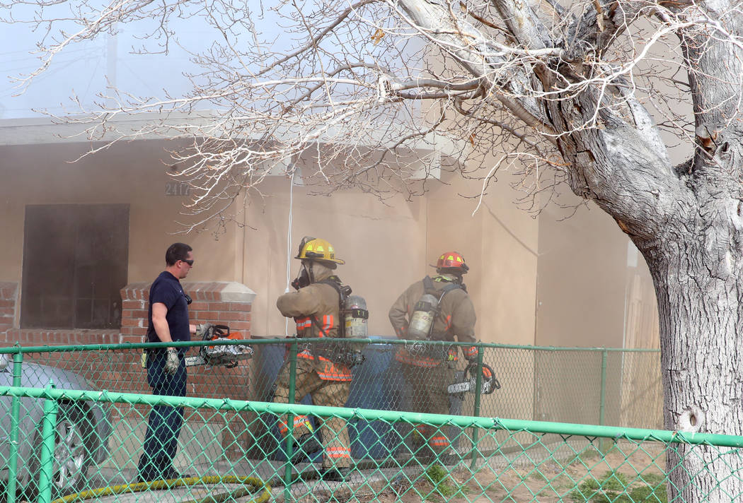 Las Vegas firefighters battle a house fire at 2417 Howard Drive on Tuesday, Feb. 18, 2020, in L ...
